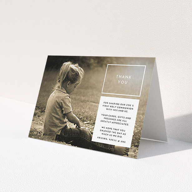 A first holy communion thank you card template titled 'Modern Side Frame'. It is an A6 card in a landscape orientation. It is a photographic first holy communion thank you card with room for 1 photo. 'Modern Side Frame' is available as a folded card, with mainly white colouring.