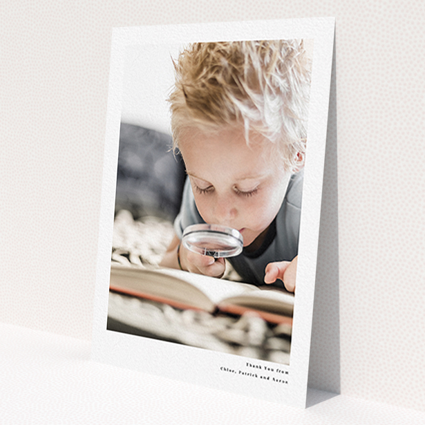 A first holy communion thank you card called 'Simple Portrait'. It is an A6 card in a portrait orientation. It is a photographic first holy communion thank you card with room for 1 photo. 'Simple Portrait' is available as a flat card, with mainly white colouring.