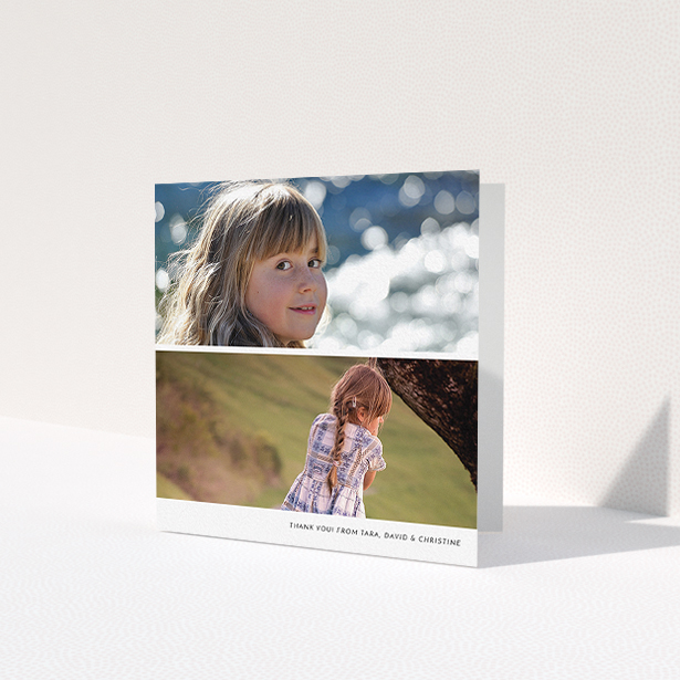 A first holy communion thank you card called 'Stacked Landscapes'. It is a square (148mm x 148mm) card in a square orientation. It is a photographic first holy communion thank you card with room for 2 photos. 'Stacked Landscapes' is available as a folded card, with mainly white colouring.