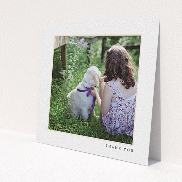 A first holy communion thank you card design called 'Thin Pink Frame'. It is a square (148mm x 148mm) card in a square orientation. It is a photographic first holy communion thank you card with room for 1 photo. 'Thin Pink Frame' is available as a flat card, with tones of white and pink.