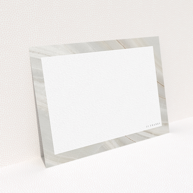 A ladies personalised note card named "Swells of marble". It is an A6 card in a landscape orientation. "Swells of marble" is available as a flat card, with tones of grey and white.