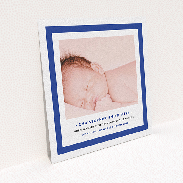 A new baby announcement card named "Big Blue". It is a square (148mm x 148mm) card in a square orientation. It is a photographic new baby announcement card with room for 1 photo. "Big Blue" is available as a flat card, with tones of blue and white.
