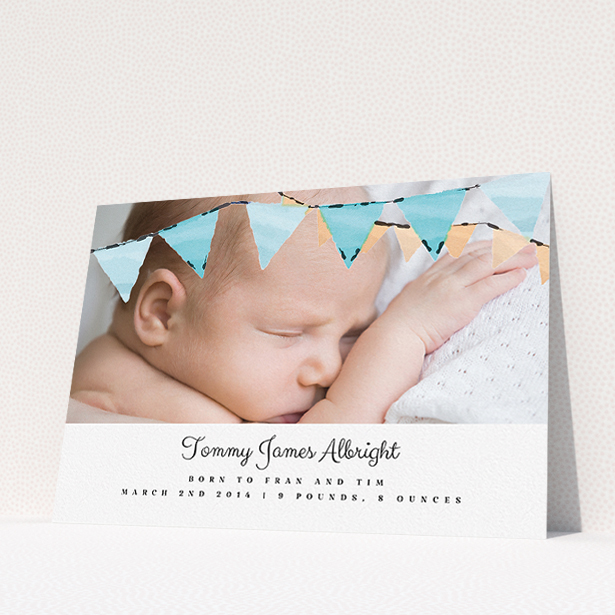 A new baby announcement card design titled "Blue Bunting". It is an A5 card in a landscape orientation. It is a photographic new baby announcement card with room for 1 photo. "Blue Bunting" is available as a flat card, with tones of blue and white.
