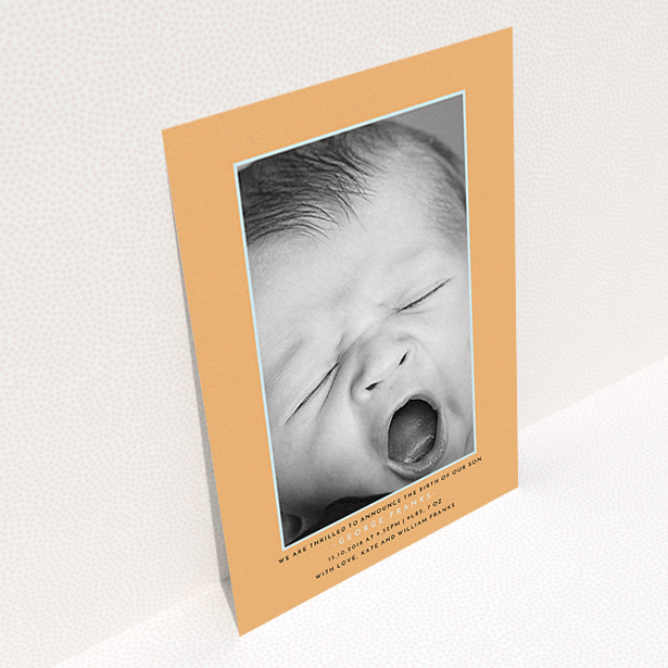 A new baby announcement card design titled "Orange and Mint". It is an A6 card in a portrait orientation. It is a photographic new baby announcement card with room for 1 photo. "Orange and Mint" is available as a flat card, with tones of orange and blue.