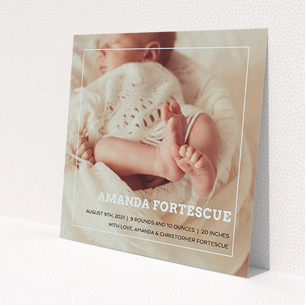 A new baby announcement card named 'Over Photo Frame'. It is a square (148mm x 148mm) card in a square orientation. It is a photographic new baby announcement card with room for 1 photo. 'Over Photo Frame' is available as a flat card, with mainly light blue colouring.