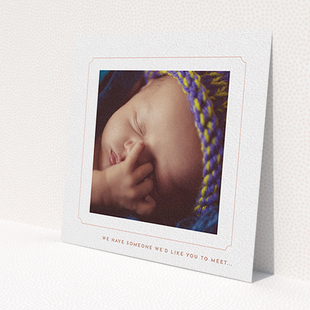 A new baby announcement card design named 'Pink notch Frame'. It is a square (148mm x 148mm) card in a square orientation. It is a photographic new baby announcement card with room for 1 photo. 'Pink notch Frame' is available as a flat card, with tones of white and pink.