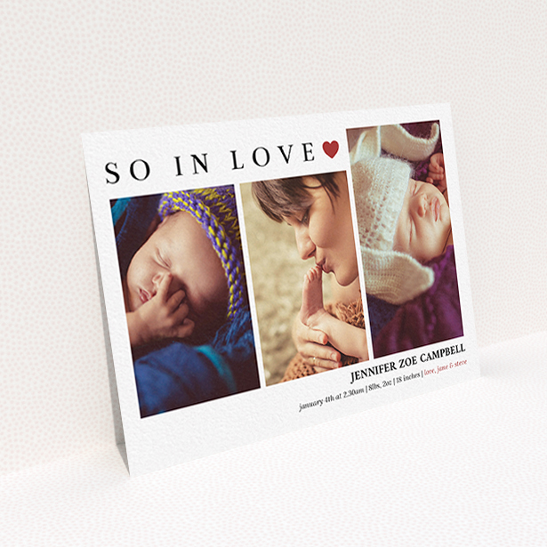 A new baby announcement card design titled "So In Love". It is an A6 card in a landscape orientation. It is a photographic new baby announcement card with room for 3 photos. "So In Love" is available as a flat card, with tones of white and red.
