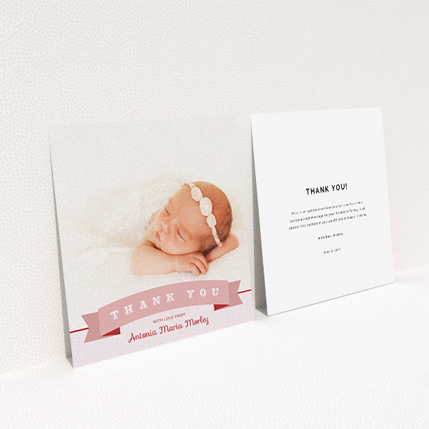 A new baby thank you card design called "Big Banner". It is a square (148mm x 148mm) card in a square orientation. It is a photographic new baby thank you card with room for 1 photo. "Big Banner" is available as a flat card, with tones of pink and white.
