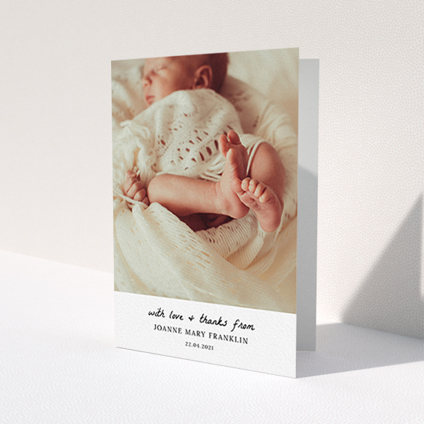 A new baby thank you card design called 'Black and White Thanks'. It is an A6 card in a portrait orientation. It is a photographic new baby thank you card with room for 1 photo. 'Black and White Thanks' is available as a folded card, with mainly white colouring.