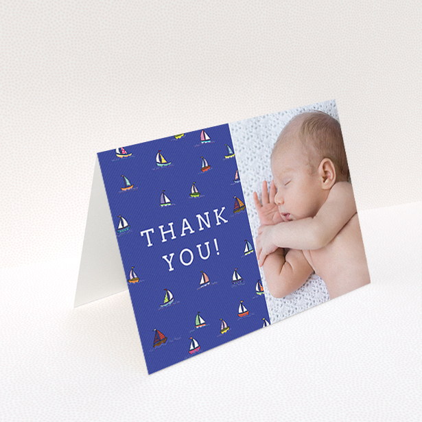 A new baby thank you card named "Cowes Week". It is an A6 card in a landscape orientation. It is a photographic new baby thank you card with room for 1 photo. "Cowes Week" is available as a folded card, with mainly blue colouring.