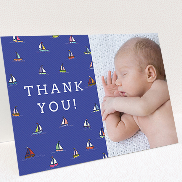 A new baby thank you card named "Cowes Week". It is an A6 card in a landscape orientation. It is a photographic new baby thank you card with room for 1 photo. "Cowes Week" is available as a folded card, with mainly blue colouring.