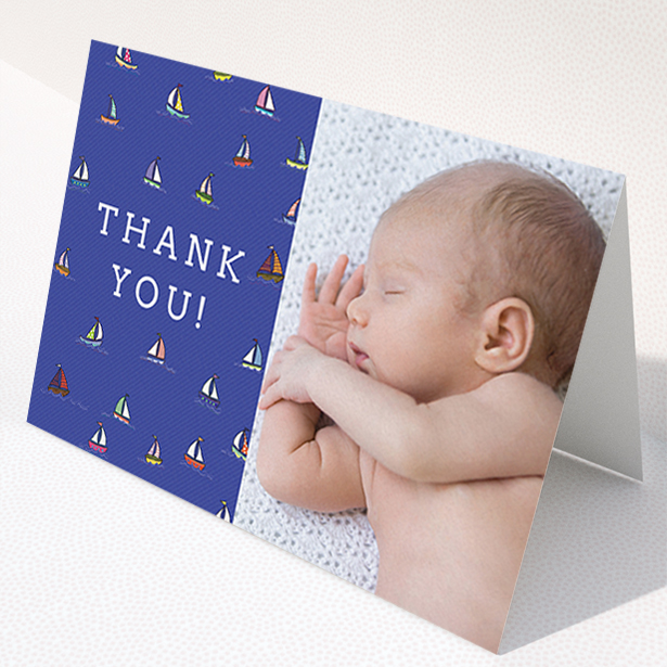 A new baby thank you card named "Cowes Week". It is an A6 card in a landscape orientation. It is a photographic new baby thank you card with room for 1 photo. "Cowes Week" is available as a folded card, with mainly blue colouring.