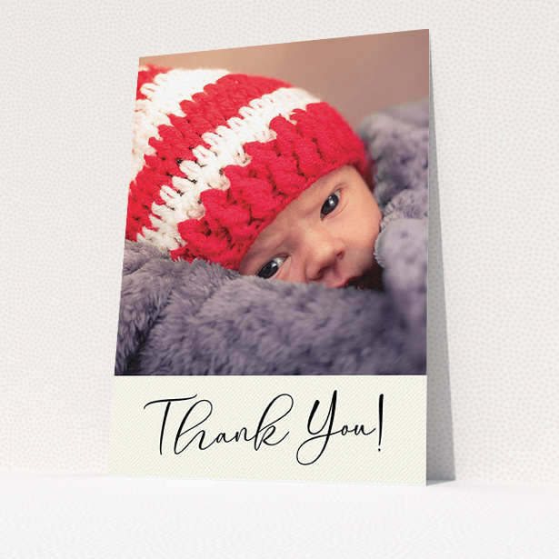 A new baby thank you card template titled "Cursive Thanks". It is an A5 card in a portrait orientation. It is a photographic new baby thank you card with room for 1 photo. "Cursive Thanks" is available as a flat card, with mainly cream colouring.