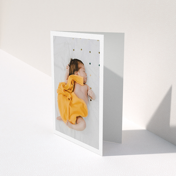 A new baby thank you card design titled "One Photo Thanks". It is an A6 card in a portrait orientation. It is a photographic new baby thank you card with room for 1 photo. "One Photo Thanks" is available as a folded card, with mainly white colouring.