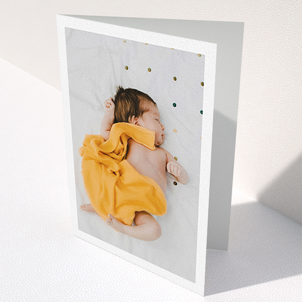 A new baby thank you card design titled "One Photo Thanks". It is an A6 card in a portrait orientation. It is a photographic new baby thank you card with room for 1 photo. "One Photo Thanks" is available as a folded card, with mainly white colouring.