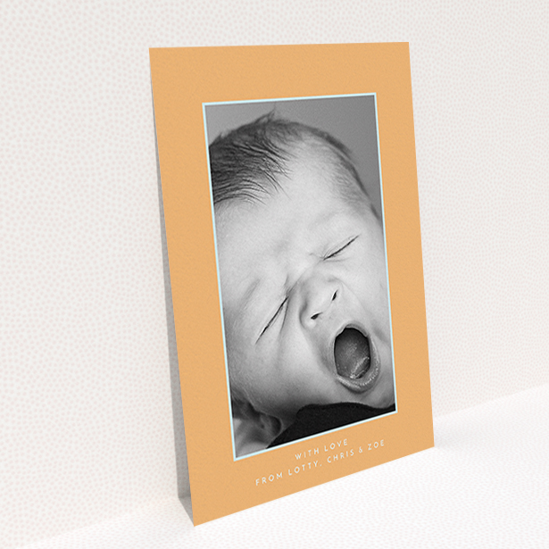A new baby thank you card design named "Orange and Mint". It is an A6 card in a portrait orientation. It is a photographic new baby thank you card with room for 1 photo. "Orange and Mint" is available as a flat card, with tones of orange and blue.