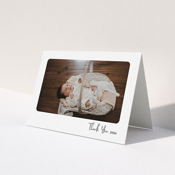 A new baby thank you card named 'Rounded Thanks'. It is an A6 card in a landscape orientation. It is a photographic new baby thank you card with room for 1 photo. 'Rounded Thanks' is available as a folded card, with mainly white colouring.