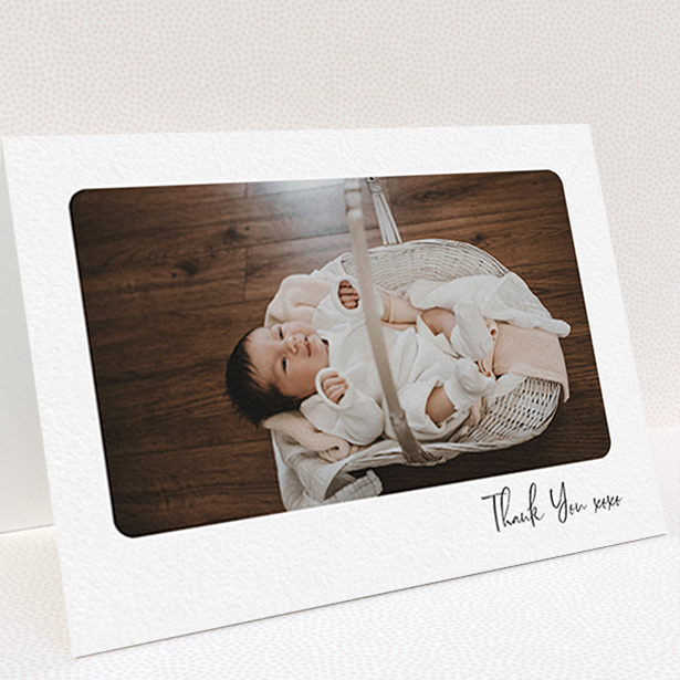 A new baby thank you card named "Rounded Thanks". It is an A6 card in a landscape orientation. It is a photographic new baby thank you card with room for 1 photo. "Rounded Thanks" is available as a folded card, with mainly white colouring.