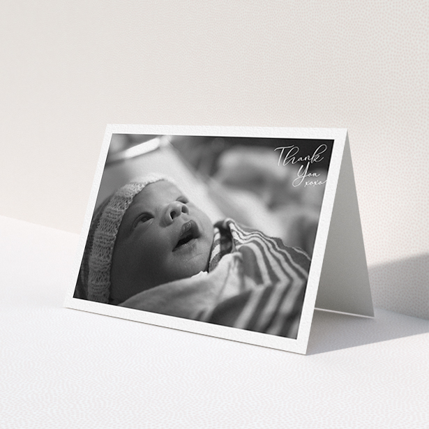A new baby thank you card design named 'Simple Landscape Thanks'. It is an A6 card in a landscape orientation. It is a photographic new baby thank you card with room for 1 photo. 'Simple Landscape Thanks' is available as a folded card, with mainly white colouring.