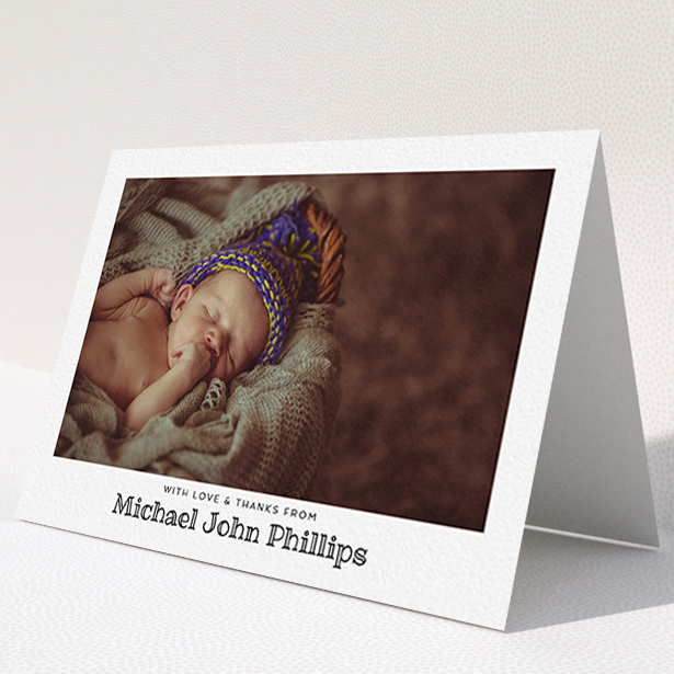 A new baby thank you card design called "Simple Photo Frame". It is an A6 card in a landscape orientation. It is a photographic new baby thank you card with room for 1 photo. "Simple Photo Frame" is available as a folded card, with mainly white colouring.