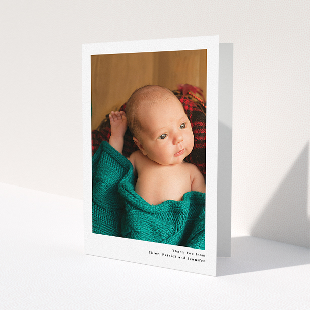 A new baby thank you card template titled 'Simple Portrait'. It is an A5 card in a portrait orientation. It is a photographic new baby thank you card with room for 1 photo. 'Simple Portrait' is available as a folded card, with mainly white colouring.