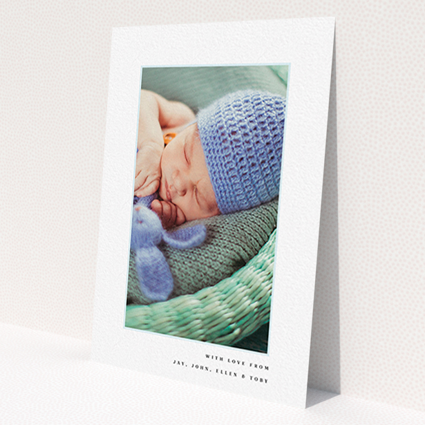 A new baby thank you card template titled 'Thin Blue Frame'. It is an A6 card in a portrait orientation. It is a photographic new baby thank you card with room for 1 photo. 'Thin Blue Frame' is available as a flat card, with tones of white and blue.