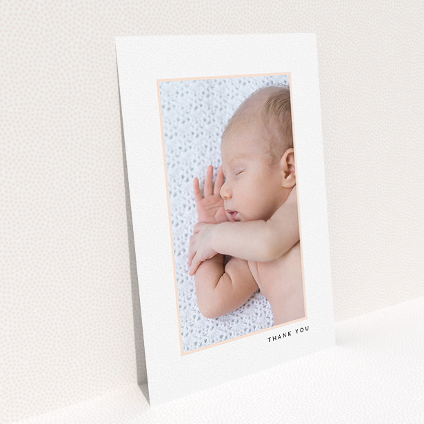 A new baby thank you card design titled "Thin Pink Frame". It is an A5 card in a portrait orientation. It is a photographic new baby thank you card with room for 1 photo. "Thin Pink Frame" is available as a flat card, with tones of white and pink.