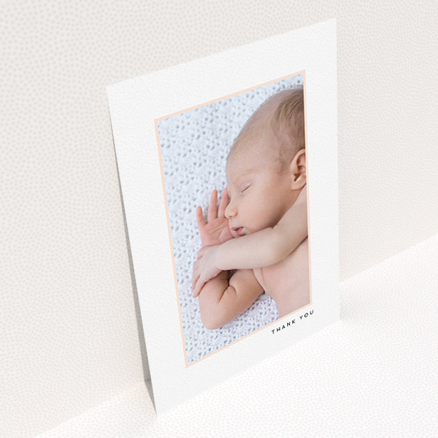 A new baby thank you card design titled "Thin Pink Frame". It is an A5 card in a portrait orientation. It is a photographic new baby thank you card with room for 1 photo. "Thin Pink Frame" is available as a flat card, with tones of white and pink.