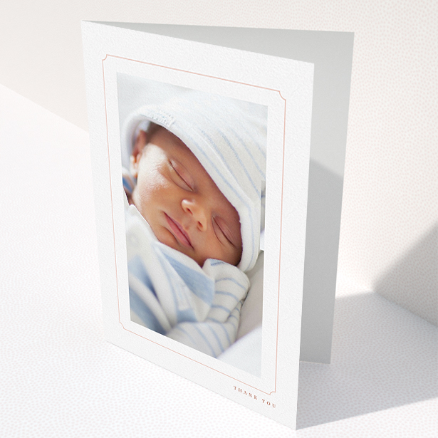 A new baby thank you card design titled "Thin Pink". It is an A5 card in a portrait orientation. It is a photographic new baby thank you card with room for 1 photo. "Thin Pink" is available as a folded card, with tones of white and pink.
