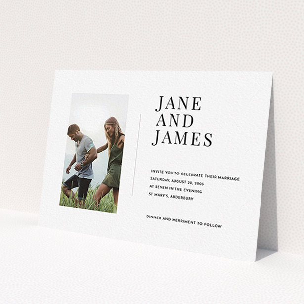 A personalised wedding invitation design named 'Modern postcard'. It is an A6 invite in a landscape orientation. It is a photographic personalised wedding invitation with room for 1 photo. 'Modern postcard' is available as a flat invite, with mainly white colouring.