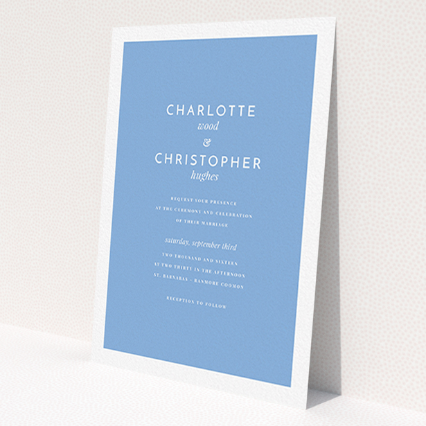 A personalised wedding invitation called 'Script switch'. It is an A6 invite in a portrait orientation. 'Script switch' is available as a flat invite, with tones of blue and white.
