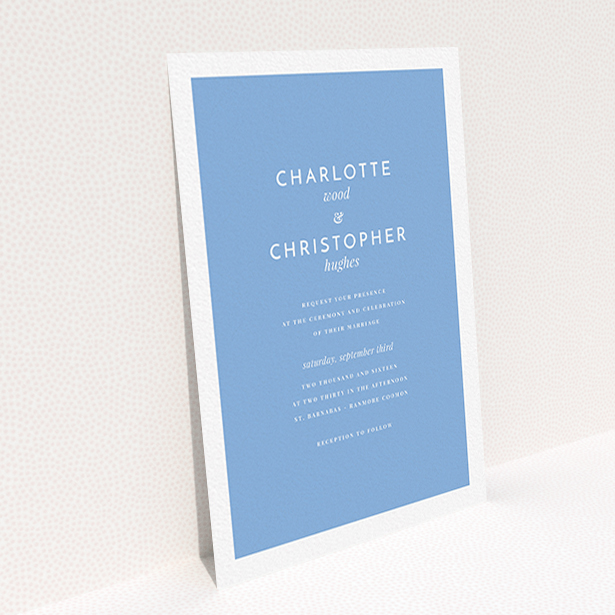 A personalised wedding invitation called "Script switch". It is an A6 invite in a portrait orientation. "Script switch" is available as a flat invite, with tones of blue and white.