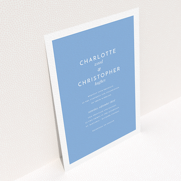 A personalised wedding invitation called "Script switch". It is an A6 invite in a portrait orientation. "Script switch" is available as a flat invite, with tones of blue and white.
