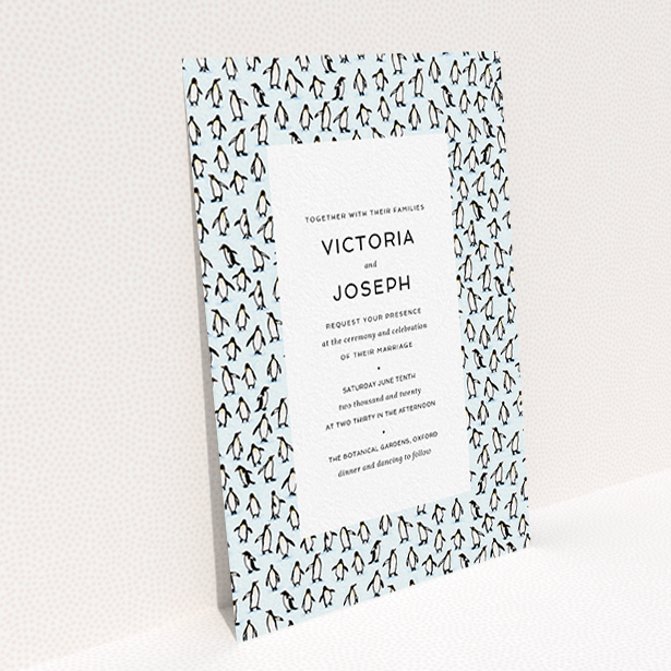 A personalised wedding invitation design titled "Tiny, Tiny Penguins". It is an A6 invite in a portrait orientation. "Tiny, Tiny Penguins" is available as a flat invite, with tones of blue and white.
