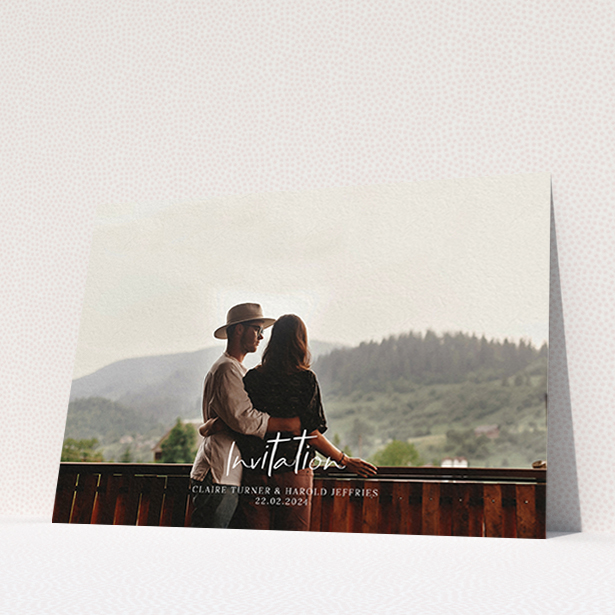 A personalised wedding invite named "Central Script". It is an A6 invite in a landscape orientation. It is a photographic personalised wedding invite with room for 1 photo. "Central Script" is available as a flat invite, with mainly white colouring.