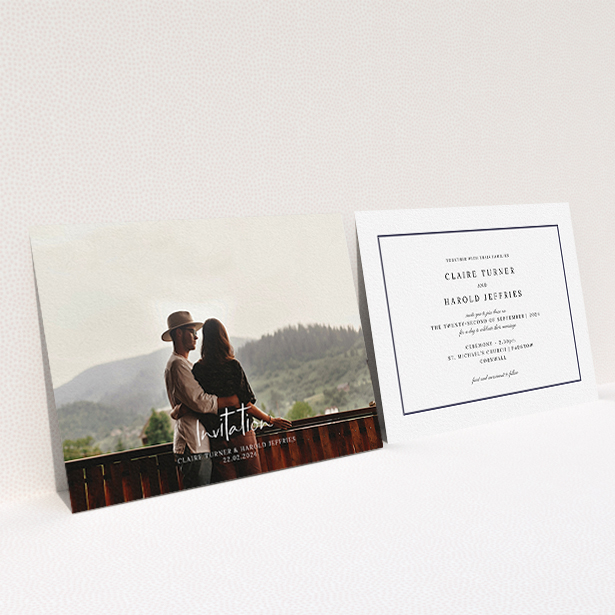 A personalised wedding invite named "Central Script". It is an A6 invite in a landscape orientation. It is a photographic personalised wedding invite with room for 1 photo. "Central Script" is available as a flat invite, with mainly white colouring.