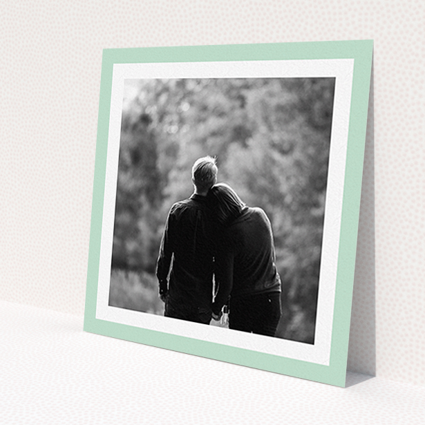 A personalised wedding invite design named 'Classic Mint Photo Frame'. It is a square (148mm x 148mm) invite in a square orientation. It is a photographic personalised wedding invite with room for 1 photo. 'Classic Mint Photo Frame' is available as a flat invite, with tones of green and white.