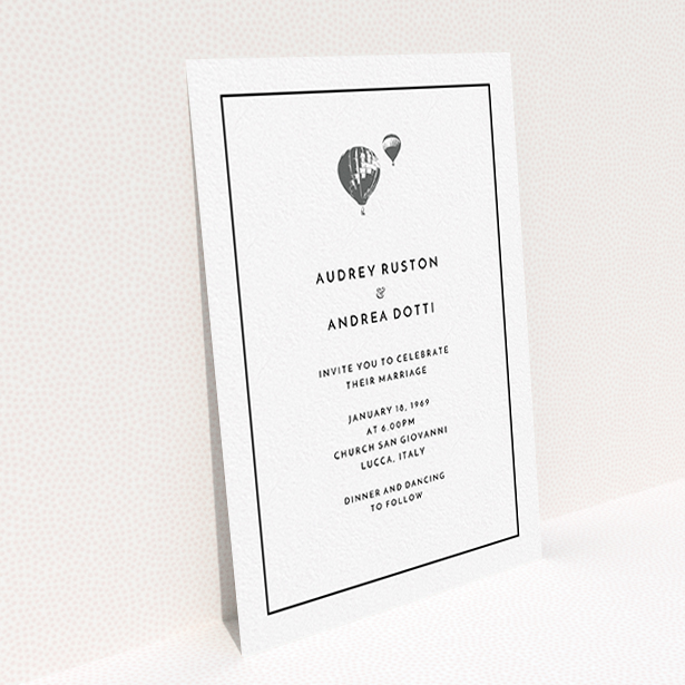 A personalised wedding invite design called "Off and away". It is an A6 invite in a portrait orientation. "Off and away" is available as a flat invite, with tones of white and grey.