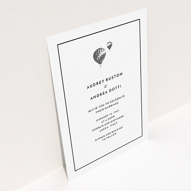 A personalised wedding invite design called "Off and away". It is an A6 invite in a portrait orientation. "Off and away" is available as a flat invite, with tones of white and grey.
