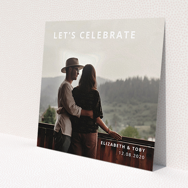 A personalised wedding invite design called 'Sans Serif'. It is a square (148mm x 148mm) invite in a square orientation. It is a photographic personalised wedding invite with room for 1 photo. 'Sans Serif' is available as a flat invite, with mainly white colouring.