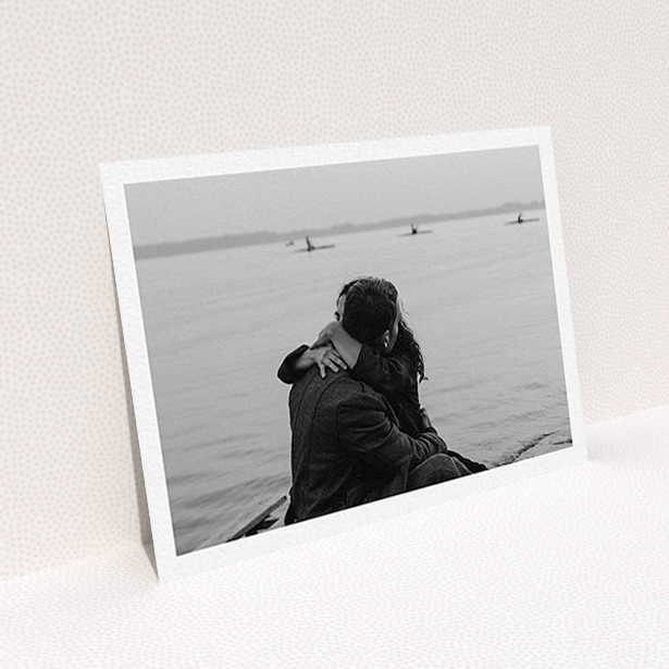 A personalised wedding invite design called "Thick White Framed Photo". It is an A6 invite in a landscape orientation. It is a photographic personalised wedding invite with room for 1 photo. "Thick White Framed Photo" is available as a flat invite.