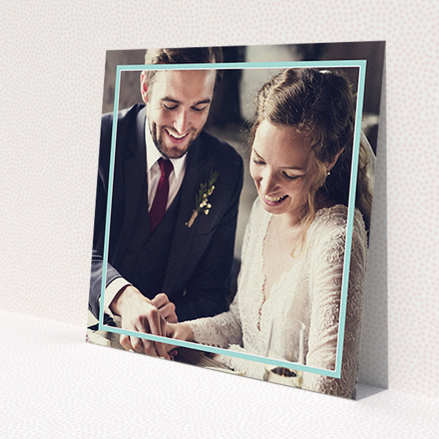 A photo wedding thank you card design titled 'Blue White Photo Frame'. It is a square (148mm x 148mm) card in a square orientation. It is a photographic photo wedding thank you card with room for 1 photo. 'Blue White Photo Frame' is available as a flat card, with mainly blue colouring.