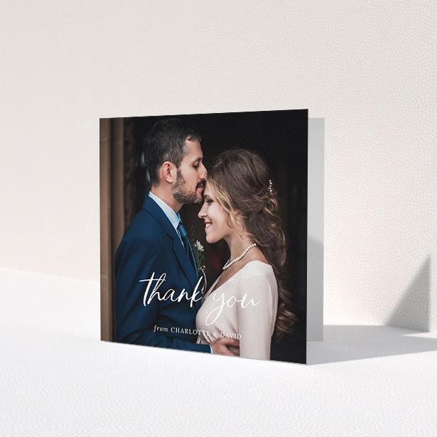 A photo wedding thank you card named 'Calligraphy Thanks'. It is a square (148mm x 148mm) card in a square orientation. It is a photographic photo wedding thank you card with room for 1 photo. 'Calligraphy Thanks' is available as a folded card, with mainly white colouring.