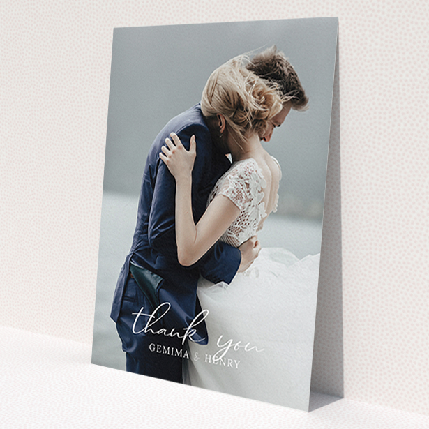 A photo wedding thank you card called 'Classic Thank You'. It is an A6 card in a portrait orientation. It is a photographic photo wedding thank you card with room for 1 photo. 'Classic Thank You' is available as a flat card, with mainly white colouring.