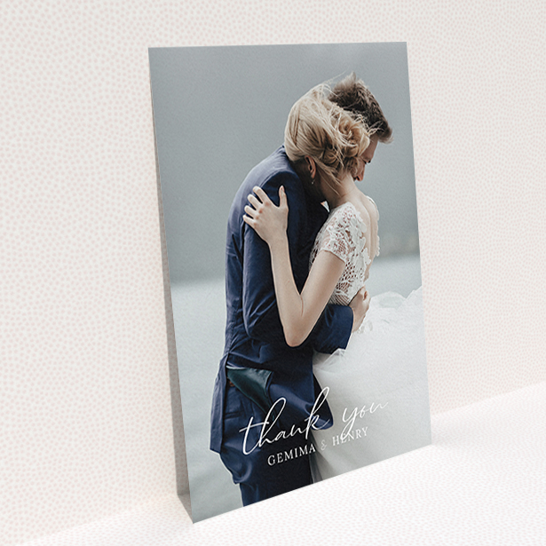 A photo wedding thank you card called "Classic Thank You". It is an A6 card in a portrait orientation. It is a photographic photo wedding thank you card with room for 1 photo. "Classic Thank You" is available as a flat card, with mainly white colouring.