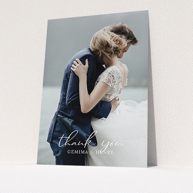 A photo wedding thank you card called "Classic Thank You". It is an A6 card in a portrait orientation. It is a photographic photo wedding thank you card with room for 1 photo. "Classic Thank You" is available as a flat card, with mainly white colouring.