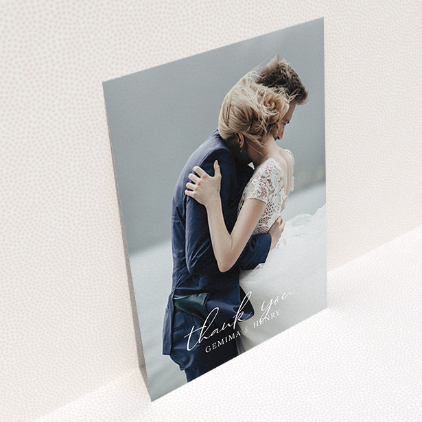 A photo wedding thank you card called "Classic Thank You". It is an A6 card in a portrait orientation. It is a photographic photo wedding thank you card with room for 1 photo. "Classic Thank You" is available as a flat card, with mainly white colouring.
