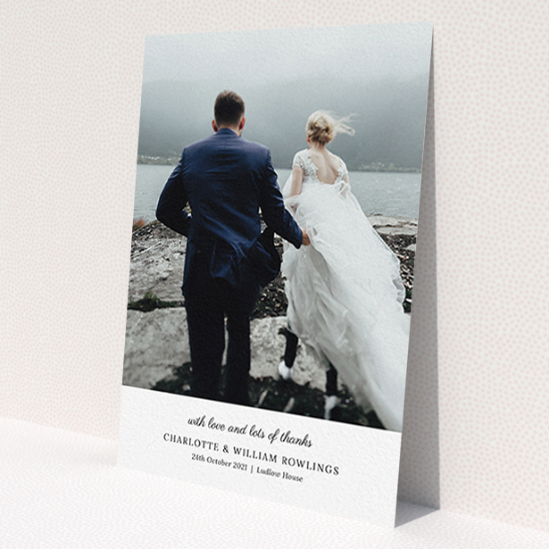 A photo wedding thank you card named 'Classic Wedding Thanks'. It is an A6 card in a portrait orientation. It is a photographic photo wedding thank you card with room for 1 photo. 'Classic Wedding Thanks' is available as a flat card, with mainly white colouring.