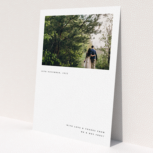 A photo wedding thank you card design called 'Modern Postcard'. It is an A6 card in a portrait orientation. It is a photographic photo wedding thank you card with room for 1 photo. 'Modern Postcard' is available as a flat card, with mainly white colouring.