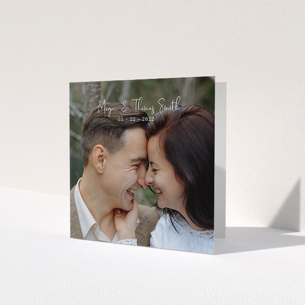 A photo wedding thank you card named 'Name-Date-Photo'. It is a square (148mm x 148mm) card in a square orientation. It is a photographic photo wedding thank you card with room for 1 photo. 'Name-Date-Photo' is available as a folded card, with mainly white colouring.